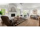 Living room features a fireplace, hardwood floors, and comfortable seating in an open floor plan at 23 Hunters Forest Dr, Charleston, SC 29414