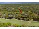 Aerial view of a home on the river near a golf course, surrounded by lush vegetation at 2455 The Bent Twig, Seabrook Island, SC 29455