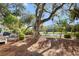 Serene backyard featuring a pond with a fountain, a grill, and mature trees for a tranquil outdoor experience at 2455 The Bent Twig, Seabrook Island, SC 29455