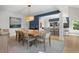 Bright dining room boasts a wooden table, modern seating, and smooth transition to the kitchen at 2455 The Bent Twig, Seabrook Island, SC 29455