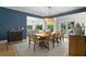 Elegant dining area features a wooden table, stylish seating, and seamless flow to the kitchen at 2455 The Bent Twig, Seabrook Island, SC 29455