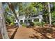 Beautiful home featuring an outdoor deck ideal for entertaining, set amongst mature trees and manicured landscaping at 2455 The Bent Twig, Seabrook Island, SC 29455