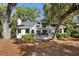 Charming home with an expansive deck, surrounded by lush trees, creating a private and inviting outdoor living space at 2455 The Bent Twig, Seabrook Island, SC 29455