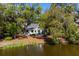 Scenic view of the home overlooking the tranquil pond and lush greenery, creating a serene and private oasis at 2455 The Bent Twig, Seabrook Island, SC 29455