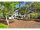 Stunning home amidst lush, mature trees with a spacious outdoor deck perfect for relaxing and entertaining guests at 2455 The Bent Twig, Seabrook Island, SC 29455