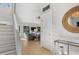 Bright foyer with hardwood floors, stairs, and a view into the living room at 2455 The Bent Twig, Seabrook Island, SC 29455