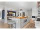 Bright kitchen with a large island and seating area, overlooking the dining room with stylish pendant lighting at 2455 The Bent Twig, Seabrook Island, SC 29455