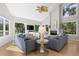 Bright living room features vaulted ceiling, lots of natural light, and comfortable seating by the fireplace at 2455 The Bent Twig, Seabrook Island, SC 29455