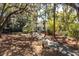 Charming home with a well-maintained lawn, mature trees, and a serene driveway, offering a welcoming ambiance at 2455 The Bent Twig, Seabrook Island, SC 29455