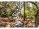 Inviting home showcases a manicured lawn, mature trees, and a long driveway, creating a welcoming entrance at 2455 The Bent Twig, Seabrook Island, SC 29455