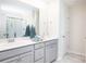 This bathroom features a double sink vanity, neutral finishes, and a glass-enclosed shower at 263 Camellia Bloom Dr, Moncks Corner, SC 29461