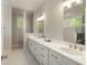Elegant bathroom with double vanity, framed mirrors, and white countertops with soft-close drawers at 3007 Cameron Blvd, Isle of Palms, SC 29451