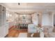 Bright living space open to a modern kitchen and dining area with hardwood floors and white accents at 3007 Cameron Blvd, Isle of Palms, SC 29451