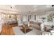 Bright living space open to a modern kitchen and dining area with hardwood floors and white accents at 3007 Cameron Blvd, Isle of Palms, SC 29451