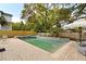 Gorgeous backyard pool with integrated spa, surrounded by lush landscaping and offering a private oasis for relaxation at 3007 Cameron Blvd, Isle of Palms, SC 29451