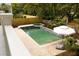 Backyard pool and spa with brick patio, surrounded by lush greenery and a privacy fence, perfect for outdoor enjoyment at 3007 Cameron Blvd, Isle of Palms, SC 29451