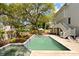 Beautiful backyard pool and spa area, surrounded by lush landscaping and offering a relaxing retreat for homeowners at 3007 Cameron Blvd, Isle of Palms, SC 29451