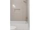 Clean white bathtub with a shower and neutral subway tile surround at 3007 Cameron Blvd, Isle of Palms, SC 29451