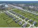 Aerial view of a Primary planned community with lush green lawns and serene lakes at 308 Cypress Branch Rd, Huger, SC 29450