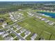 Aerial view of a planned community featuring tree-lined streets, cul-de-sacs, and green lawns at 308 Cypress Branch Rd, Huger, SC 29450
