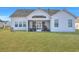 Well-maintained backyard with lush green lawn, perfect for outdoor activities and relaxation at 308 Cypress Branch Rd, Huger, SC 29450
