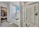Bright bathroom highlighting a tub, glass shower, and a walk-in closet at 308 Cypress Branch Rd, Huger, SC 29450