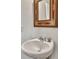 Close-up of a stylish bathroom sink with a decorative wood-framed mirror at 308 Cypress Branch Rd, Huger, SC 29450