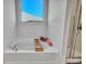 Bright bathroom featuring a bathtub, a window with natural light, and glass enclosed shower at 308 Cypress Branch Rd, Huger, SC 29450