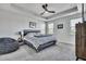 Spacious bedroom with a king-size bed, tray ceilings, and neutral decor at 308 Cypress Branch Rd, Huger, SC 29450