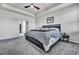 Spacious bedroom featuring plush carpeting and a cozy bed topped with a soft, grey blanket at 308 Cypress Branch Rd, Huger, SC 29450