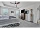 Comfortable bedroom featuring a ceiling fan, and a stylish dresser with a large flat screen tv on top at 308 Cypress Branch Rd, Huger, SC 29450