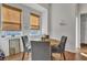 Cozy dining nook with natural window shades, table and seating for four at 308 Cypress Branch Rd, Huger, SC 29450