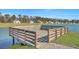 Wooden dock overlooking a scenic lake with houses visible in the background at 308 Cypress Branch Rd, Huger, SC 29450