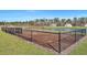 Community dog park with black chain link fence overlooking a lake and wooded area at 308 Cypress Branch Rd, Huger, SC 29450