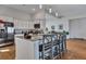 Bright kitchen featuring a granite island, stainless steel refrigerator and modern lighting at 308 Cypress Branch Rd, Huger, SC 29450