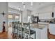 Kitchen island featuring a granite countertop, barstool seating, and stainless steel faucet at 308 Cypress Branch Rd, Huger, SC 29450