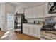 Well-equipped kitchen with stainless steel refrigerator, granite countertops and ample cabinetry at 308 Cypress Branch Rd, Huger, SC 29450