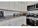 Granite countertops and modern appliances outfit this well-equipped kitchen at 308 Cypress Branch Rd, Huger, SC 29450