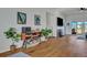 Comfortable living room area with a fireplace, television, and hardwood floors at 308 Cypress Branch Rd, Huger, SC 29450