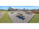 Picnic tables on a gravel area next to the community clubhouse and lake at 308 Cypress Branch Rd, Huger, SC 29450