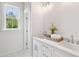 Bright bathroom featuring dual sinks, granite counters, and modern fixtures at 3107 S Shore Dr, Charleston, SC 29407
