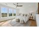 Bright bedroom with a large window view, featuring a plush bed and stylish decor at 3107 S Shore Dr, Charleston, SC 29407