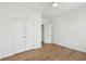 Bright bedroom featuring hardwood floors, a ceiling fan, and a closet with paneled doors at 3107 S Shore Dr, Charleston, SC 29407