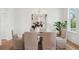 Elegant dining room featuring a rustic table, six chairs, and modern accents at 3107 S Shore Dr, Charleston, SC 29407