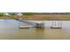 An aerial view shows a covered dock extending into the waterway, providing recreation and relaxation at 3107 S Shore Dr, Charleston, SC 29407