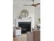 Living room fireplace with white mantel, dark hearth, and decorative accents at 3107 S Shore Dr, Charleston, SC 29407