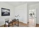 Bright office space featuring a desk, chair, area rug and view to a hallway through an open doorway at 3107 S Shore Dr, Charleston, SC 29407