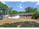 Back exterior featuring a spacious backyard, siding and brick at 3227 Stonehaven Dr, North Charleston, SC 29420