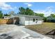 View of backyard featuring a concrete pad, green grass and fenced-in yard at 3227 Stonehaven Dr, North Charleston, SC 29420