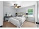Cozy bedroom with a ceiling fan, and a bed adorned with decorative pillows at 3227 Stonehaven Dr, North Charleston, SC 29420